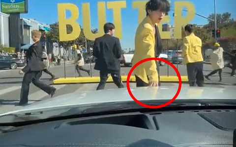 Người qua đường may mắn được một thành viên BTS chạm tay vào ôtô