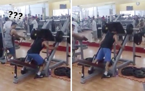 Người đàn ông tập thiết đầu công trong phòng gym