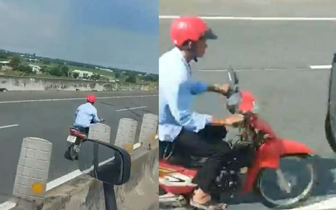 Núp sau xe tải rồi bất ngờ phóng xe máy chạy ngược chiều vào làn cao tốc