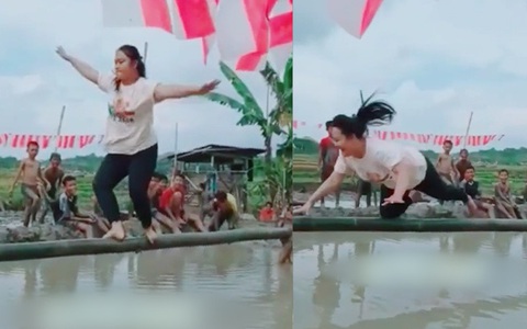 Cô gái nhuộm bùn khi đi cầu kiều