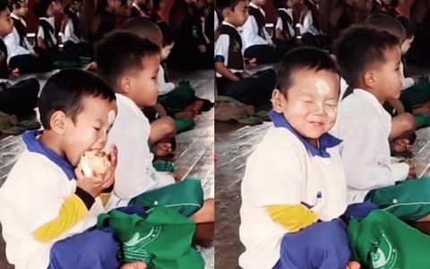 Biểu cảm đáng yêu của bé trai khi ăn vụng