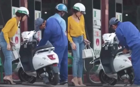 Cô gái dắt xe máy điện đi đổ xăng khiến mọi người hoang mang