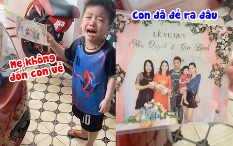 Bé trai khóc nức nở vì xem ảnh cưới bố mẹ không thấy mình