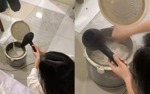 Cô gái dùng máy sấy tóc xử lý nồi cơm nhão