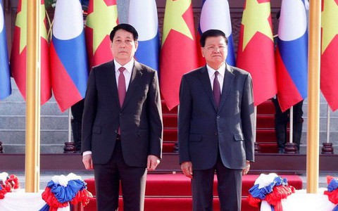 Lễ đón trọng thể Chủ tịch nước Lương Cường lần đầu thăm Lào