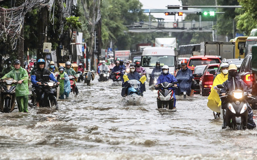 Hanoi streets flooded as torrential downpours triggered by storm Kajiki drench the capital