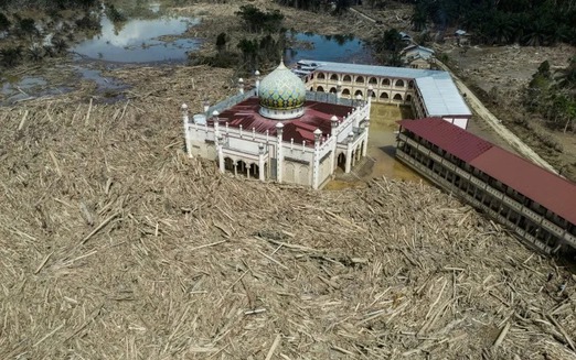 Nowhere to pray as logs choke flood-hit Indonesian mosque