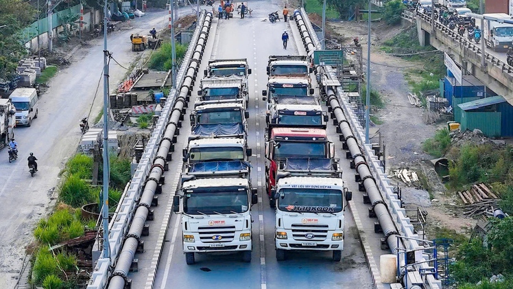 Dùng 10 xe tải kiểm tra khả năng chịu lực của cầu Bình Phước 1 sau khi nâng tĩnh không