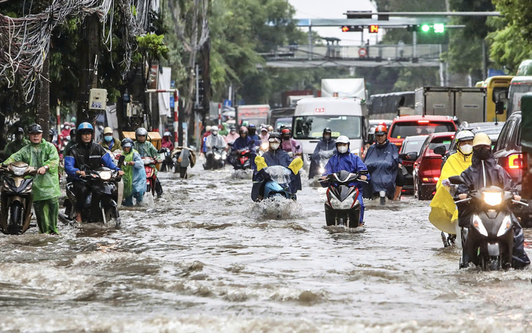 Hanoi streets flooded as torrential downpours triggered by storm Kajiki drench the capital