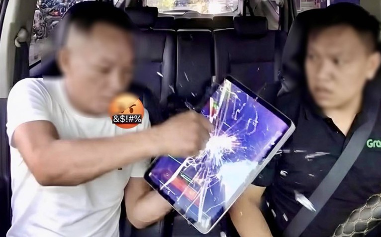 Người đánh tài xế Grab vì không được hút thuốc trong xe đã ra trình diện công an