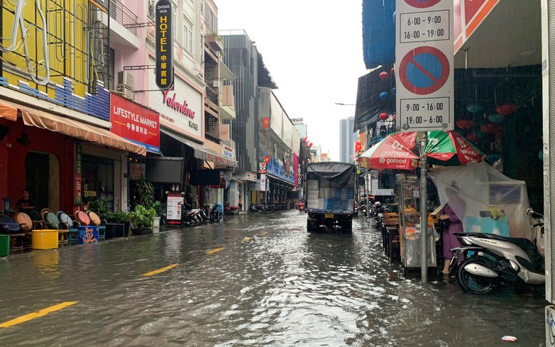 Ho Chi Minh City’s ‘backpacker street’ flooded after hour-long downpour